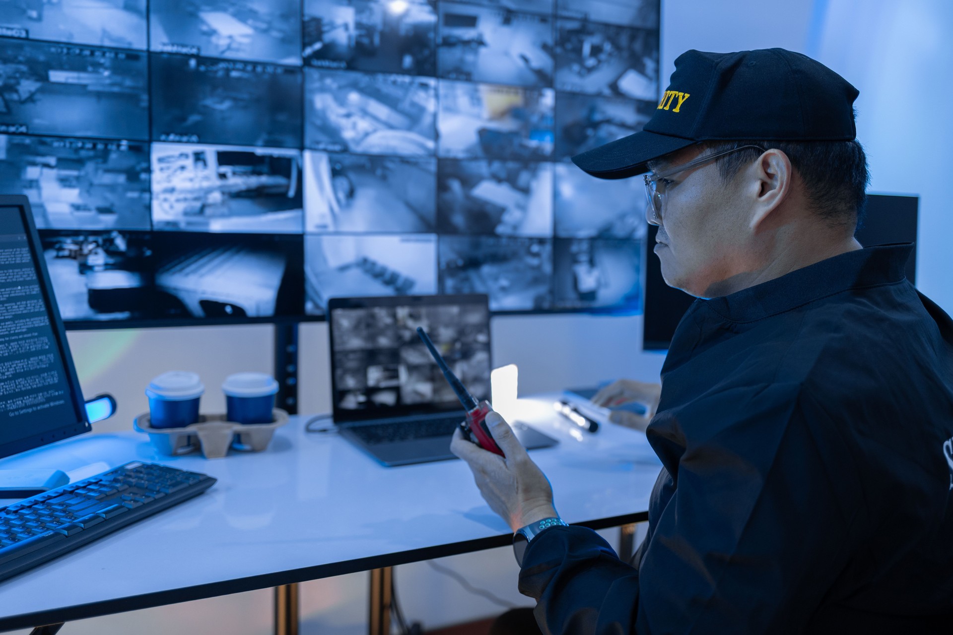 Security Man guard, Working in Control room by cctv monitor for protection, data center or building safety. Inspection, video surveillance agency and control room with footage, View Monitor and computer